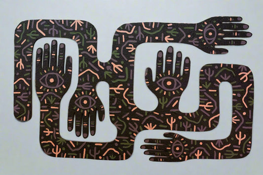 A brown, olive green, tan, and purple  laser cutting of hands that include texture. The large artwork depicts scenes that include saguaro cacti and mountains.