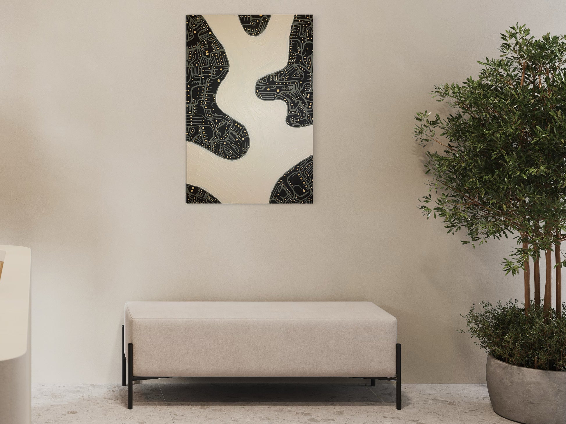 A textural tan, black and yellow painting hanging  over a bench